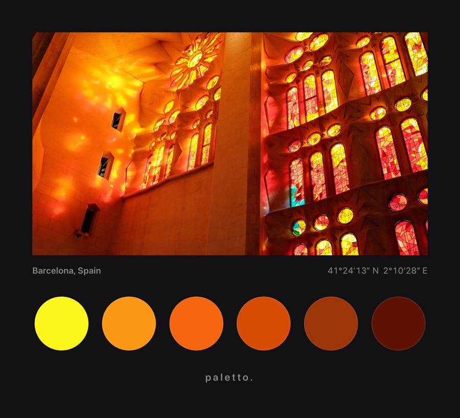 Stained glass in the Sagrada Família on a black matte with orange dots, Barcelona and its coordinates